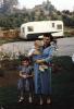 Woman with baby son, daughter, trailer, dress, 1950s, PORV30P06_08