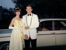 Woman and Man going out on a prom, car, suit, formal attire, flowers, 1960s, PORV30P08_19
