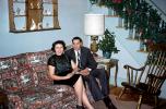 Woman and Man on a sofa, lamp, stairs, rocking chair, 1950s