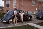 Man and Woman Goofing, Volkswagen Beetle Car, July 1959, PORV31P03_10