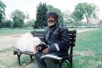 Homeless Man Sitting on a Bench, POUV01P03_10