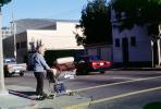 Homeless Man with a shopping cart, crosswalk, street, car, POUV01P08_07