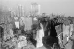 Woman, Shanty Home, Shack, apartment buildings, slum, Mumbai, India