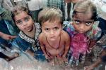 Two Girls and a Boy, INtense Stare, eyes, in the Slums of Mumbai