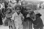 Girl smiles, boy smiling, shanty town, slum, Mumbai, India