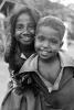 Girl smiles, boy smiling, shanty town, slum, Mumbai, India, POVPCD3306_091B