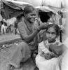 Mother and her Daughter, hair, smiles, sari, shanty town, slum, Mumbai, India