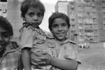 brother and sister, smile, boy, girl, slums, shacks, shanty town, Mumbai, India