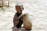 Boy eating from a bowl, Lake Turkana, refugee, African Diaspora, POVV01P07_02