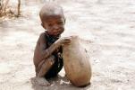 Boy eating from a bowl, Lake Turkana, refugee, African Diaspora, POVV01P07_03