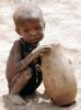 Boy eating from a bowl, Lake Turkana, refugee, African Diaspora, POVV01P07_03B