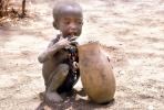 Boy eating from a bowl, Lake Turkana, refugee, African Diaspora, POVV01P07_04