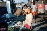 Woman dumping trash, Dharavi Mumbai, POVV01P09_03