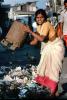 Woman dumping trash, Dharavi Mumbai, POVV01P09_03B