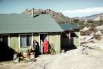 home, house, women, desert, rifle, Vasquez Rocks, December 1958, 1950s, PRGV01P12_10
