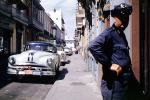 Cars, sidewalk, buildings, town, Oldsmobile, San Juan Puerto Rico, 1950s