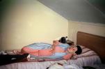 Woman Falling Asleep in Bed with a Cigarette, camera