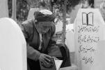 Public reader in a cemetery, Iran