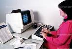 IBM Computer, Business Woman, Businesswoman, monitor, office, worker, employee, desk, people, trader, broker, stocks and bonds, paper, paperwork, 1984, 1980s, PWWV01P12_17