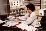 Woman, desk, paperwork, paper stacks, pile, 1990's, PWWV05P04_01
