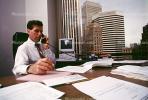 Man, Male, Paperwork, computer, phone, conversing, landline, desk, office, 1990's, businessman
