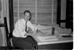Man, Desk, Paperwork, levelor blinds, office, businessman, 1950s