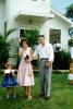 finished a church service, building, lawn, daughter, mother, father, bible, dress, sandals, the Pariers, 1950s, RCTV11P06_03