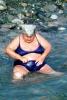 Overweight Lady sitting in the water at Sochi Russia, RVLV01P06_11B