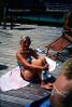Woman Sitting on a Dock, sun tan, burn, RVLV01P09_06