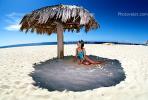 Woman on a Beach, Pacific Ocean, sand, grass thatched parasol, shade, shadow, Sod, RVLV02P08_17