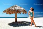 Woman on a Beach, Pacific Ocean, sand, grass thatched parasol, shade, shadow, Sod, RVLV02P08_19