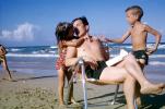 Father, Daughter, Son, Beach, chair, Ocean, summer, 1950s, RVLV06P03_15