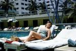 Woman, poolside, recliner chair, Motel, 1950s