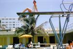 Sitting high on a diving board, sunning, motel, 1950s, RVLV08P08_15