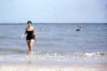 Beach, Ocean, Woman, Suntan, Sunburn, Walking, 1950s, RVLV09P01_01