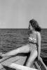 Woman on a rowboat, swimsuit, swimwear, 1940s
