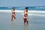 Woman wading, walking, beach, ocean, waves, suntan, sun exposure, sun burn, 1976, 1970s, RVLV09P14_16