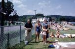 Women, Man, girl, sun worshippers, fence, swimmwear, 1959, 1950s, RVLV09P15_07