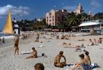 Waikiki Beach, sun tanning, buildings, Honolulu, 1950s, RVLV10P03_07