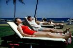 Woman, Man, lounging, lounge chairs, lawn, 1950s, RVLV10P04_19