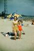 Mother with Daughter, Beach, sand, parasol, swimsuit, bathing suit, 1950s, RVLV10P06_10