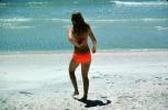 Woman walks into the water, beach, tanning, sun worshipper, bikini, RVLV10P07_03