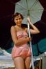 Lady Smiles in a diaper like Swimsuit under Umbrella, 1950s, RVLV10P12_16