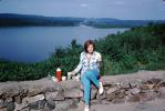Woman Overlooking a Lake, Pants, Thermos, Rock Wall, 1960s, RVPV01P10_07