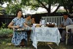 Women Eating, Table, meat, backyard picnic, 1950s