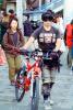Boy walking his bike, glasses, goggles, SBYV03P14_17