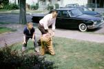 Father Playing Football with Sons, Ford Galaxy, 1960s, SFCV01P14_17