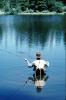 Fisherman, lake, waterproof fishing pants, forest, trees