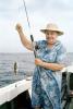 fisherwomen, woman, fish catch, hat, dress, smile, Outer Banks, North Carolina, 1965, 1960s
