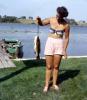 fish catch, Woman, Boat, pink pants, legs, knees, shoes, bra, fashion, 1950s, SFIV02P10_15
